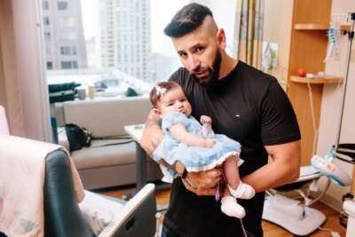 A program in a handful of states is monitoring the physical and mental health of new dads. (Courtesy of Ann & Robert H. Lurie Children’s Hospital of Chicago via the FCHIP Fathers Photobook)