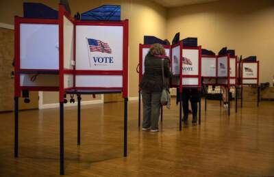 Voters cast their ballots at a polling location in Watertown Massachusetts in 2020. (Robin Lubbock/WBUR)