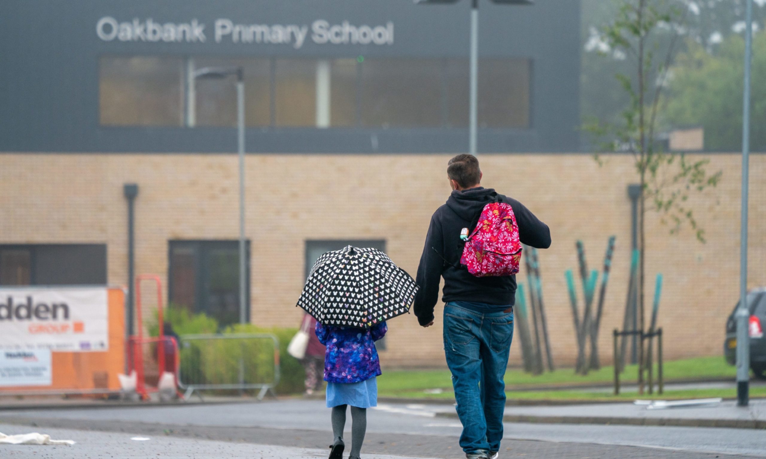 Parents dropping off pupils at Covid-hit Oakbank Primary School.