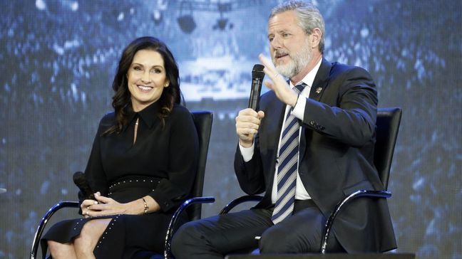 FILE -This Wednesday Nov. 28, 2018 file photo shows Rev. Jerry Falwell Jr., right, and his wife, Becki during after a town hall at a convocation at Liberty University in Lynchburg, Va. (AP Photo/Steve Helber)