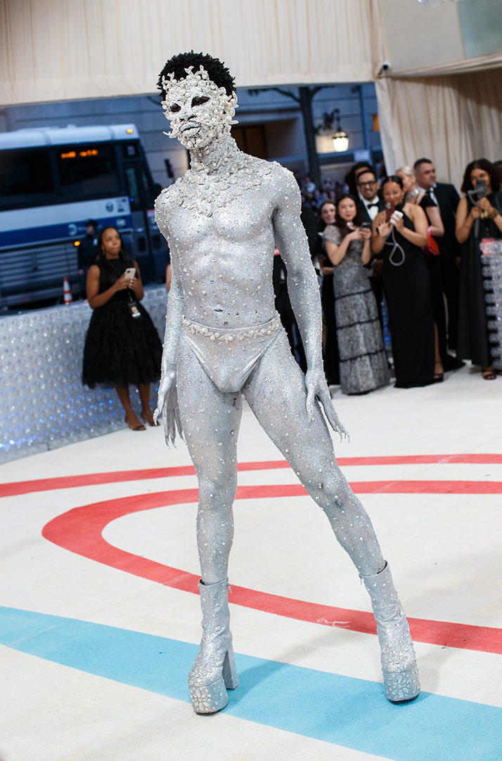 Lil Nas X’s Met Gala 2023 Look Shimmers With Silver Thong & Crystals WWD