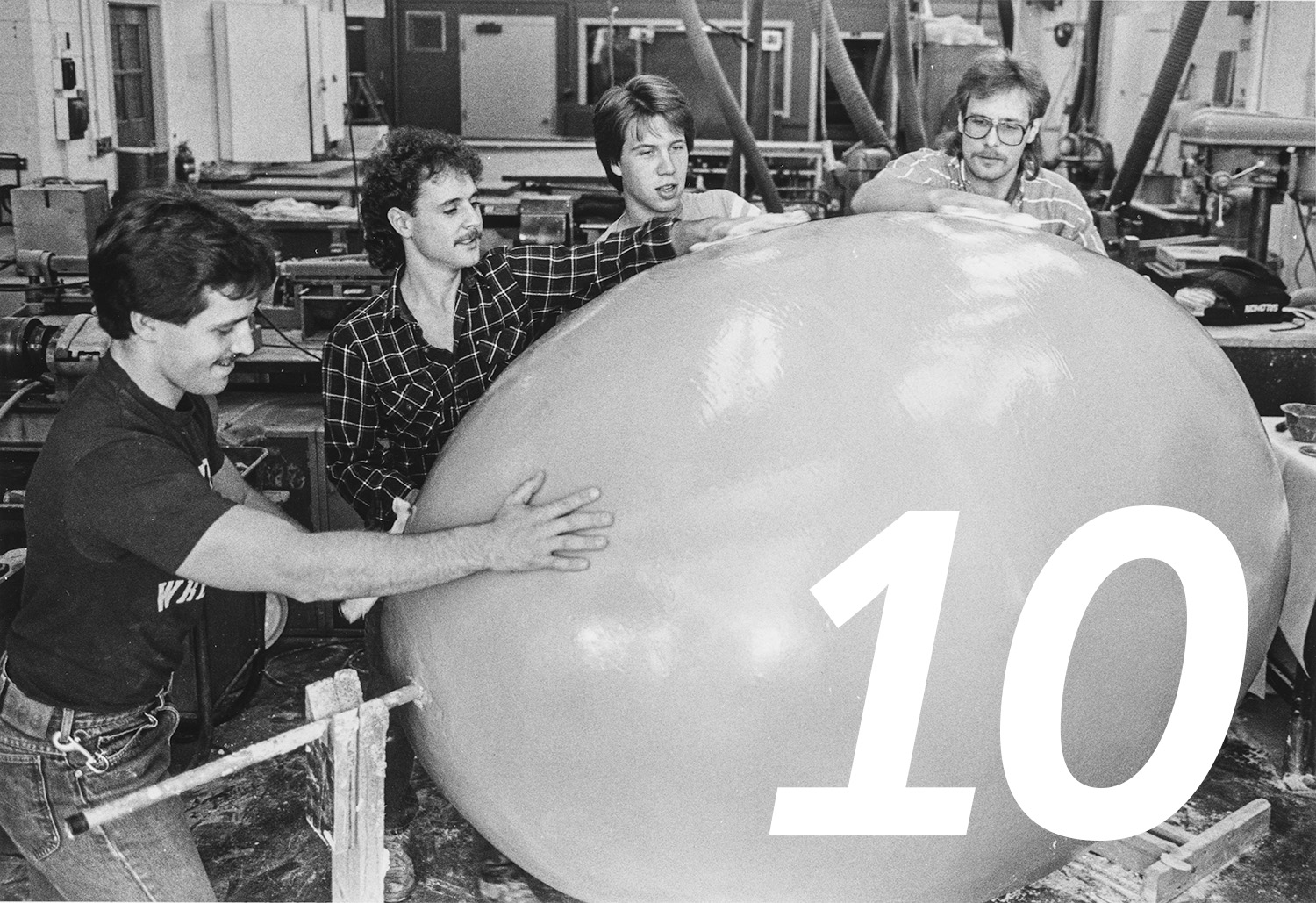 Kent Technology Education Club members polish a fiberglass and resin egg in 1985