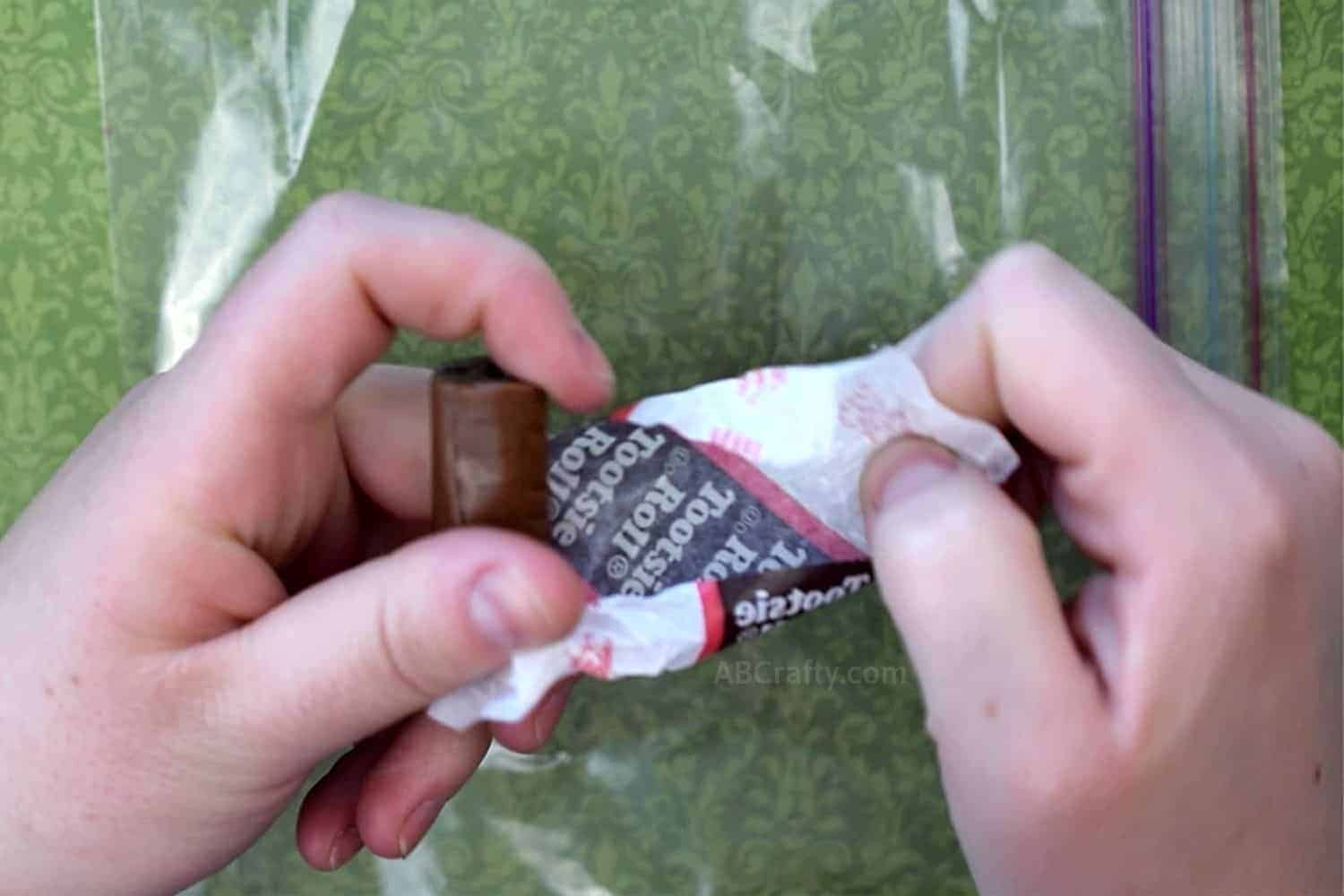 Unwrapping a tootsie roll