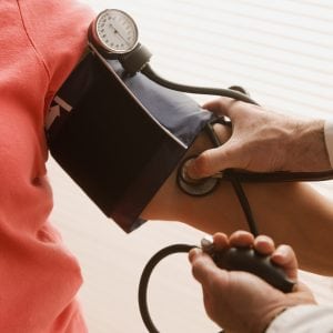 woman having her blood pressure checked