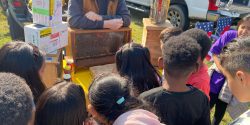 A beekeeper talking to kids about bees.