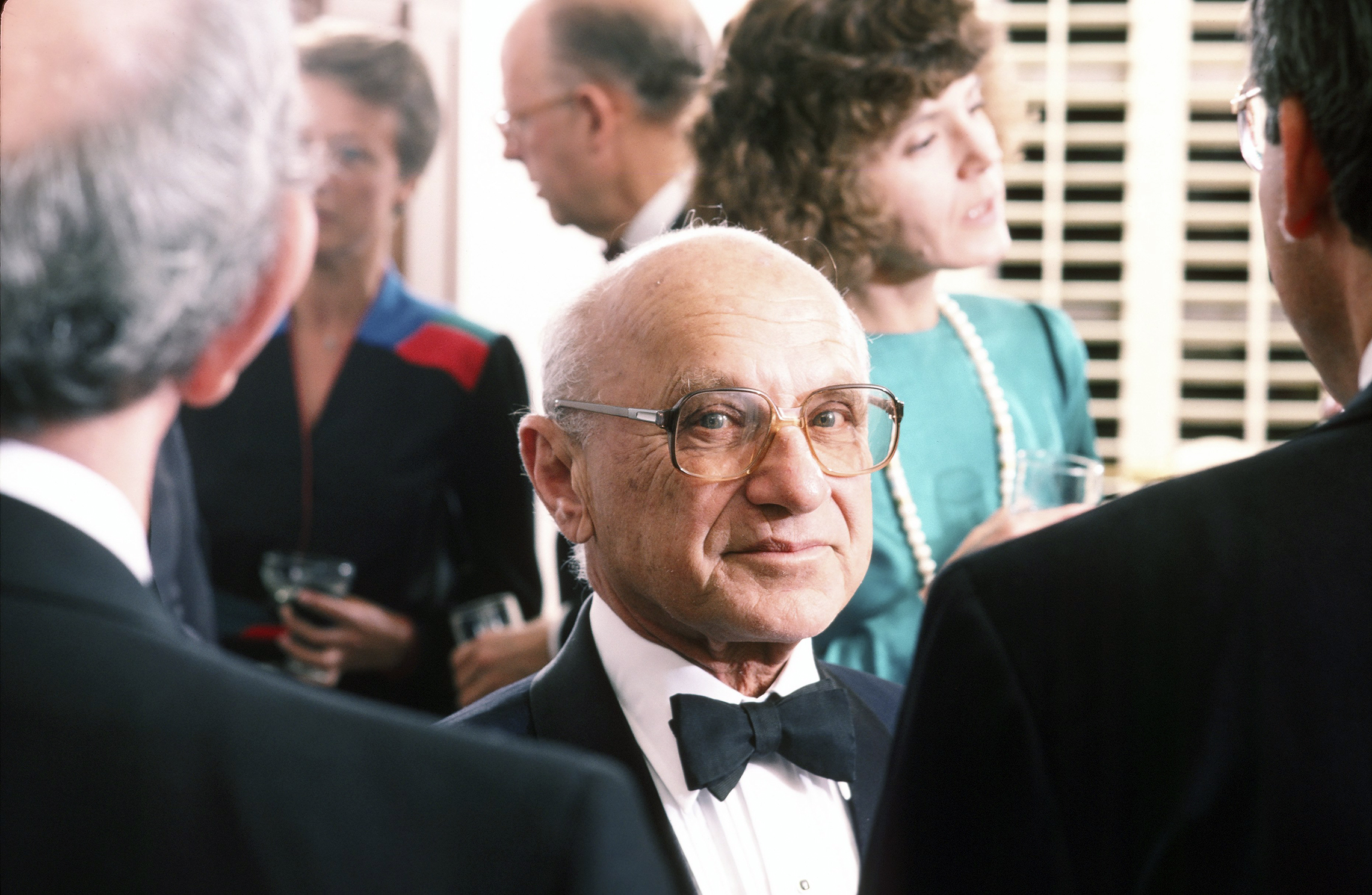 1986: Nobel Prize-winning economist Milton Friedman attends a Beverly Hills charity dinner in his honor. For much of the 1980s, Friedman's economic policies helped shape the United States and the world. "Known at his pinnacle as 'Margaret Thatcher’s favorite economist' and hailed almost universally as the instigator of monetarist economics, Friedman was a pivotal intellectual inspiration for the Reagan and Thatcher revolutions of the 1980s. Friedman did not invent monetarism — it had been first discussed centuries earlier — but he did combine academic pre-eminence and popular showmanship to propel it to the forefront of politics. (George Rose/Getty)