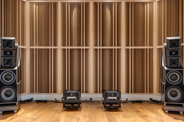 wall of acoustic sound diffusers with wilson audio speakers in front