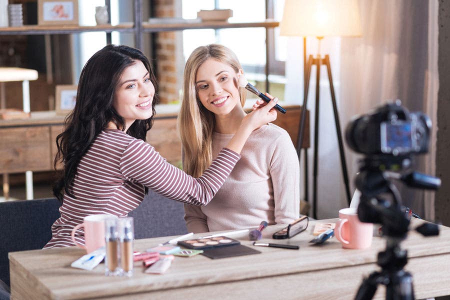 Two women filming a video for YouTube