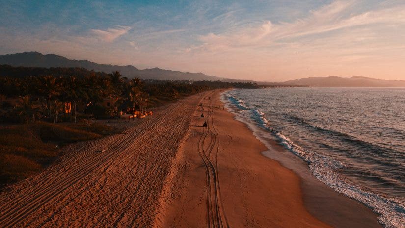 drone advertising over a beach by alex jumper via unsplash