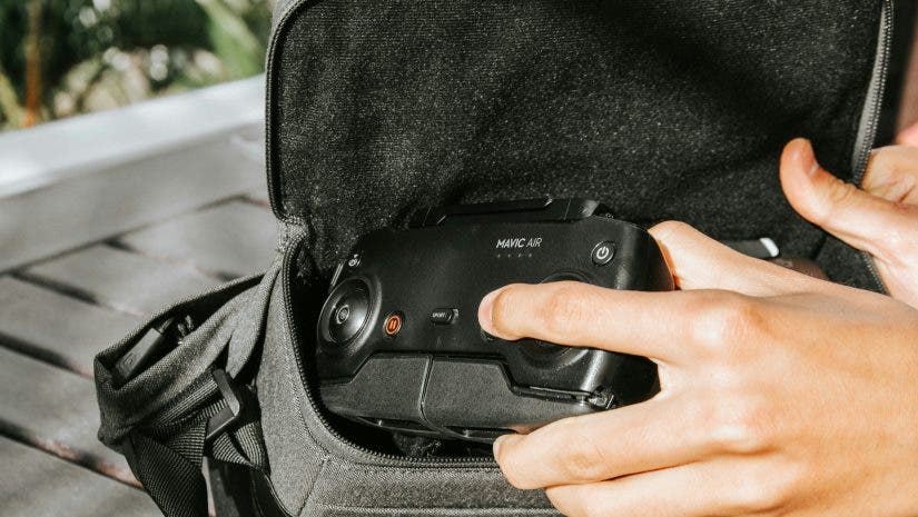 A drone user placing his drone in a drone case