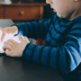 A small child enjoying screen time.