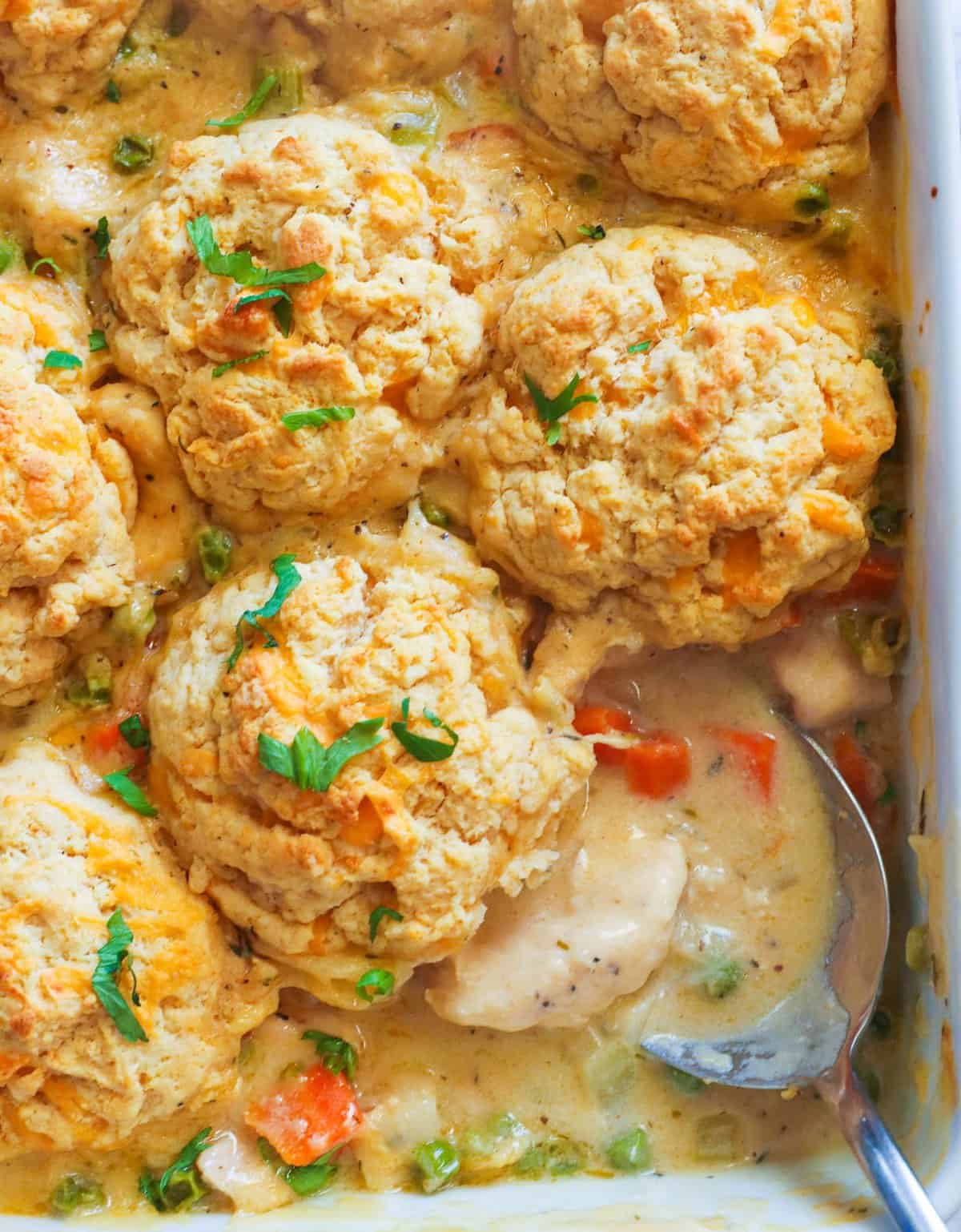 Creamy Chicken and Biscuits with peas and carrots and decadent creamy gravy