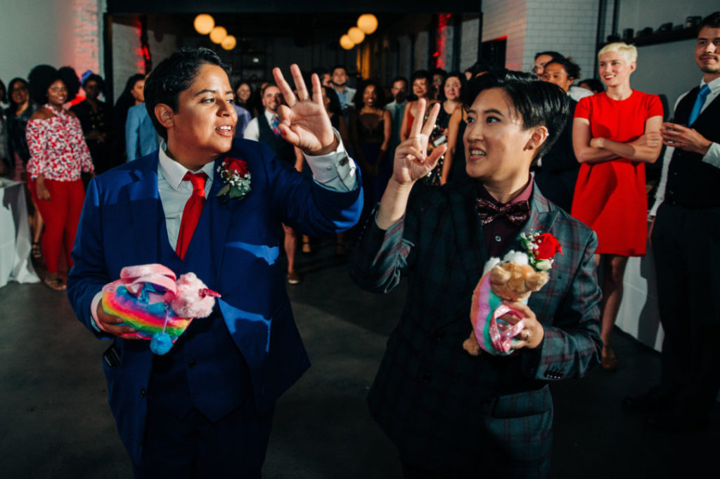 newlyweds prepare to toss stuffed animals into crowd