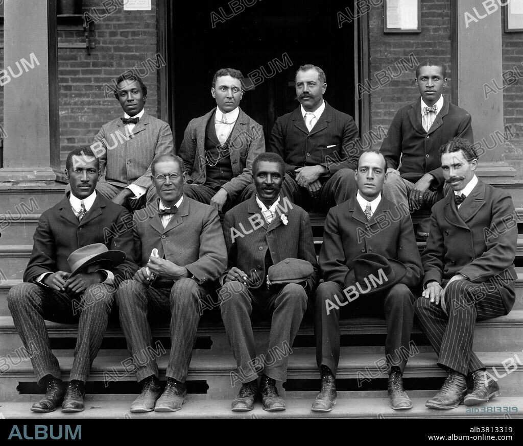 Carver, seated on steps with staff, at the Tuskegee Institute. George Washington Carver (1864 - January 5, 1943) was an African-American scientist, botanist, educator, and inventor born into slavery. In 1891 he attended and studied botany at Iowa State Agricultural College where he was the first black student, and later taught as the first black faculty member. His reputation is based on his research into and promotion of alternative crops to cotton, such as peanuts, soybeans and sweet potatoes, which also aided nutrition for farm families. He wanted poor farmers to grow alternative crops both as a source of their own food and as a source of other products to improve their quality of life. As an agricultural chemist, Carver discovered three hundred uses for peanuts and hundreds more for soybeans, pecans and sweet potatoes. He died in 1943, at the age of 78. In 1977, he was elected to the Hall of Fame for Great Americans. In 1990, he was inducted into the National Inventors Hall of Fame. Carver is often referred to as "Father of Chemurgy". Photographed by Frances Benjamin Johnston, 1902.