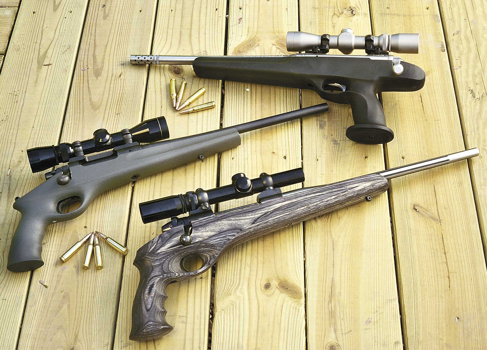 outdoors wood planks baords guns pistols three