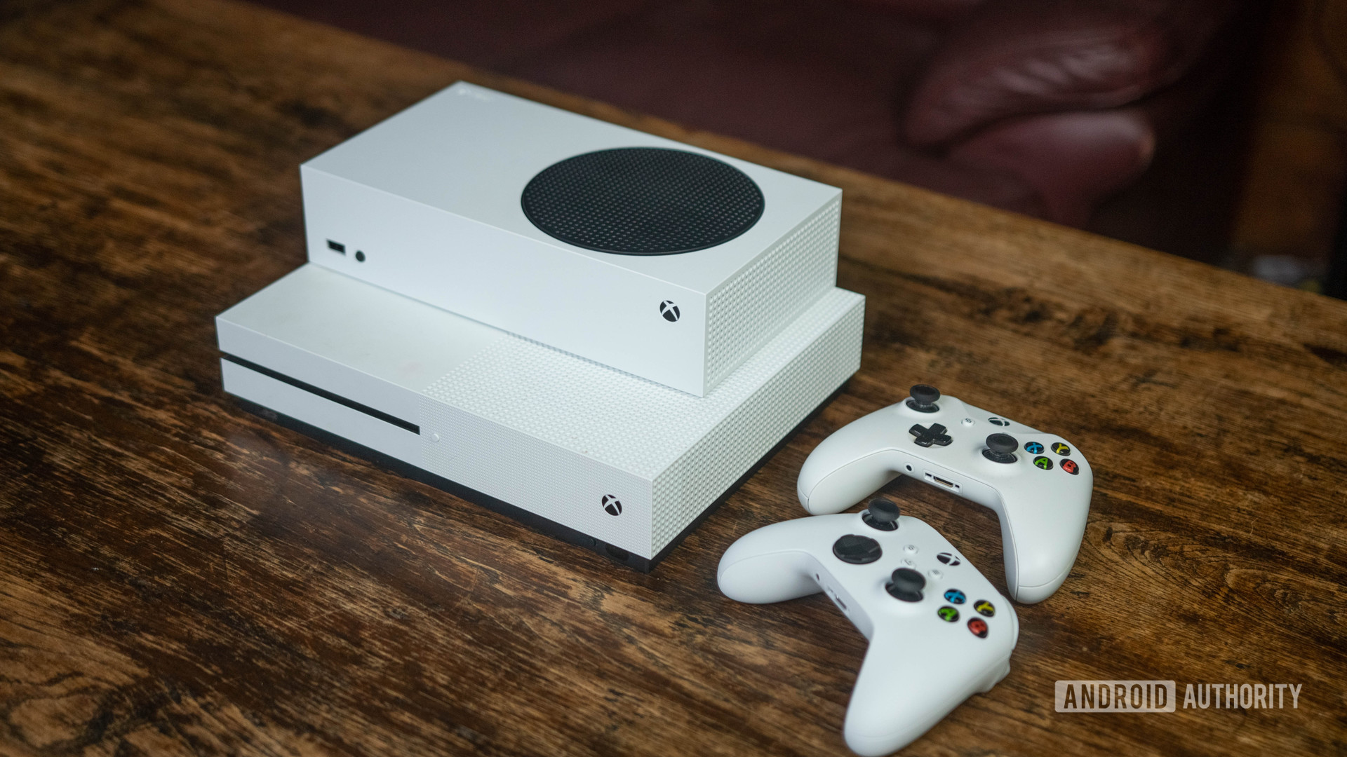 Xbox Series S and One S controller and consoles on a table