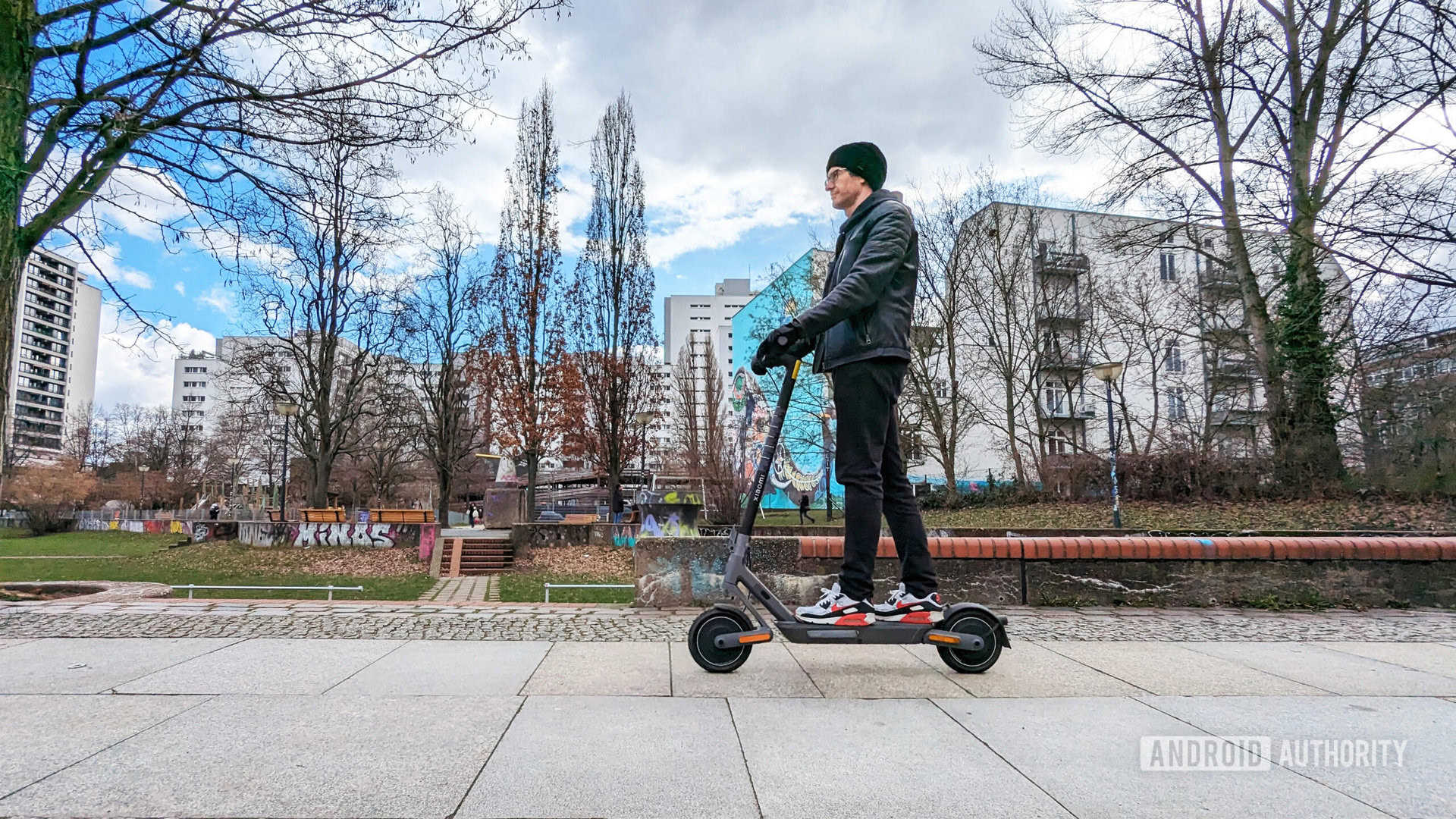 Xiaomi Electric Scooter 4 Ultra ridden by a man side on