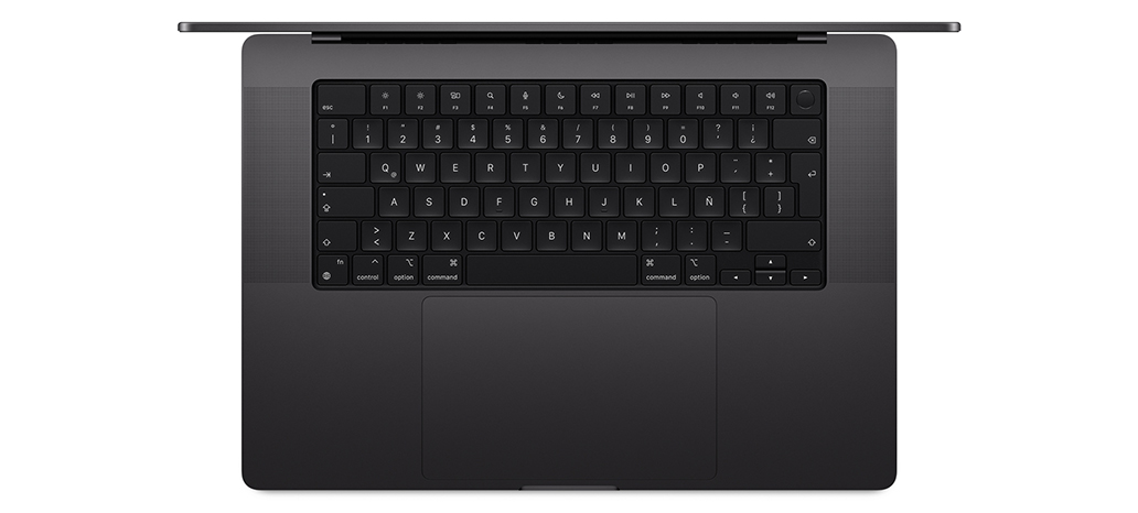 Vista desde arriba de una MacBook Pro que muestra el Magic Keyboard integrado con Touch ID y trackpad