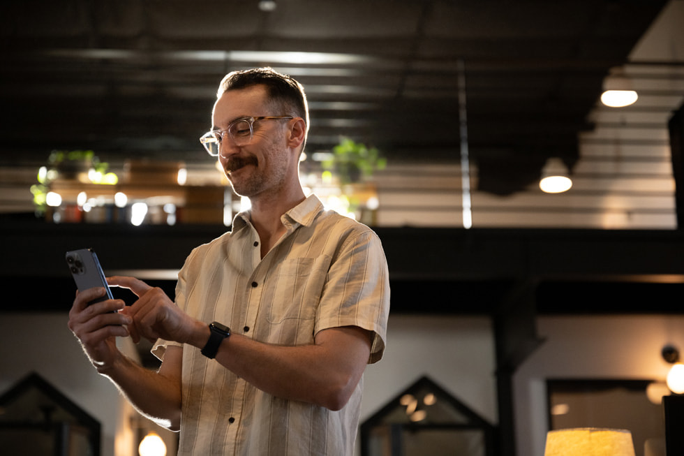 Max Williamson is shown using iPhone.