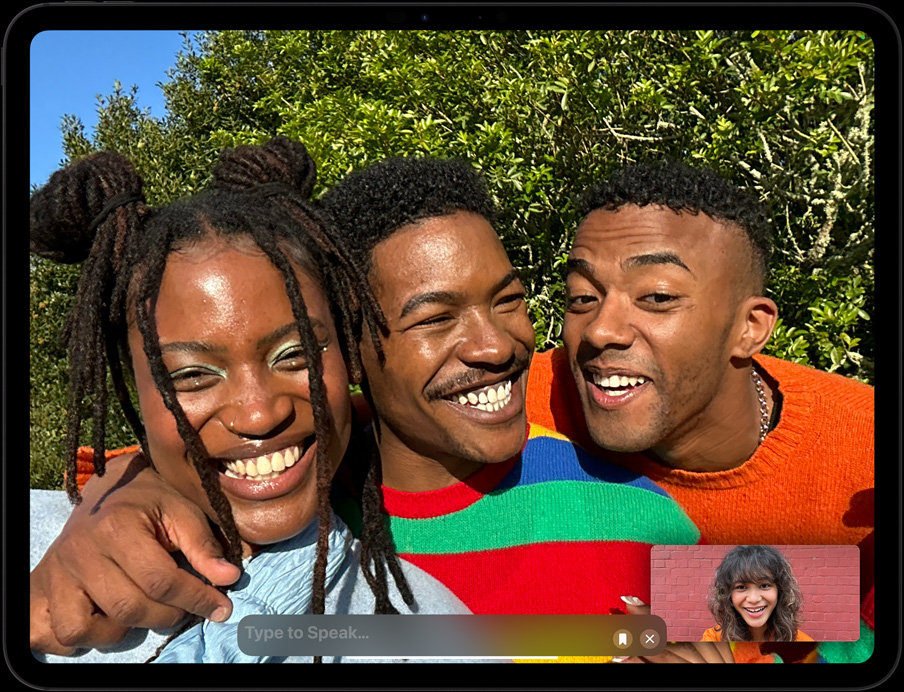 Landscape orientation, iPad Pro, user is on a FaceTime call, there is a section on the screen where the user can type to speak