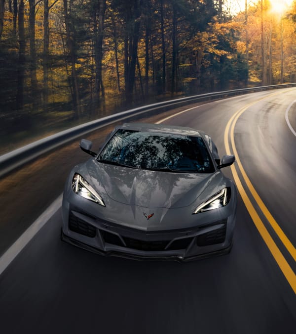 Aerial front shot of Corvette E-Ray driving on road