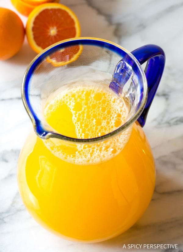 Southern orangeade in a glass pitcher. 