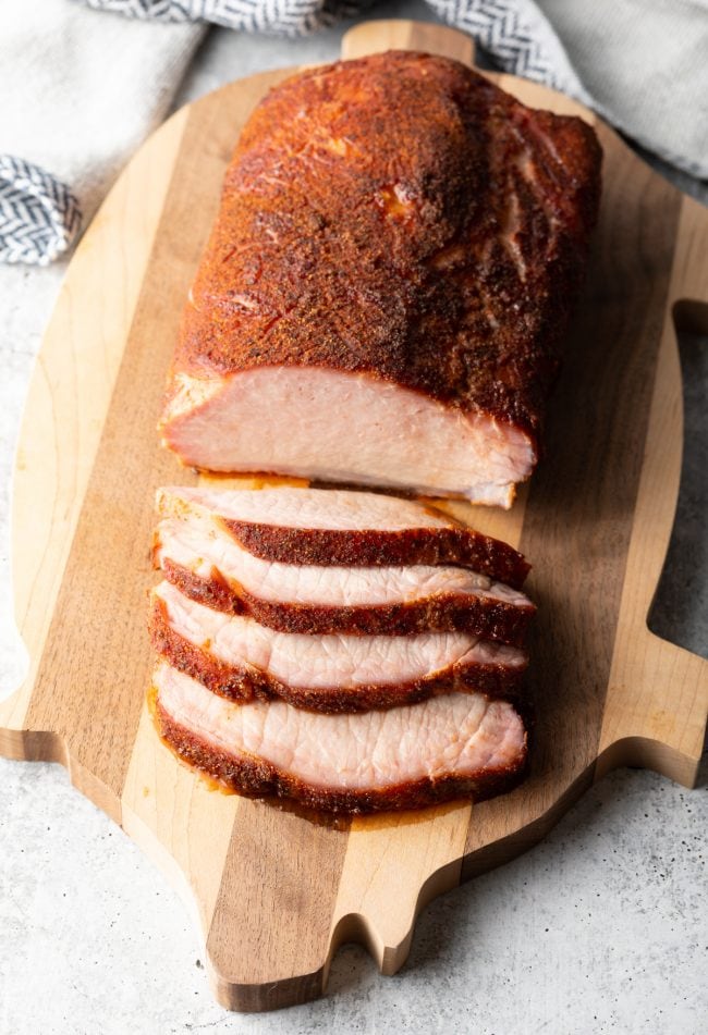 Smoked Pork Loin Rub - top view sliced loin on a cutting board