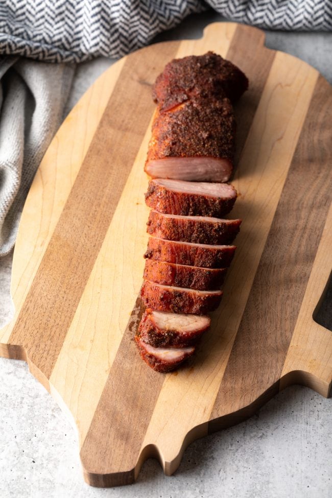 top view sliced pork tenderloin on a cutting board