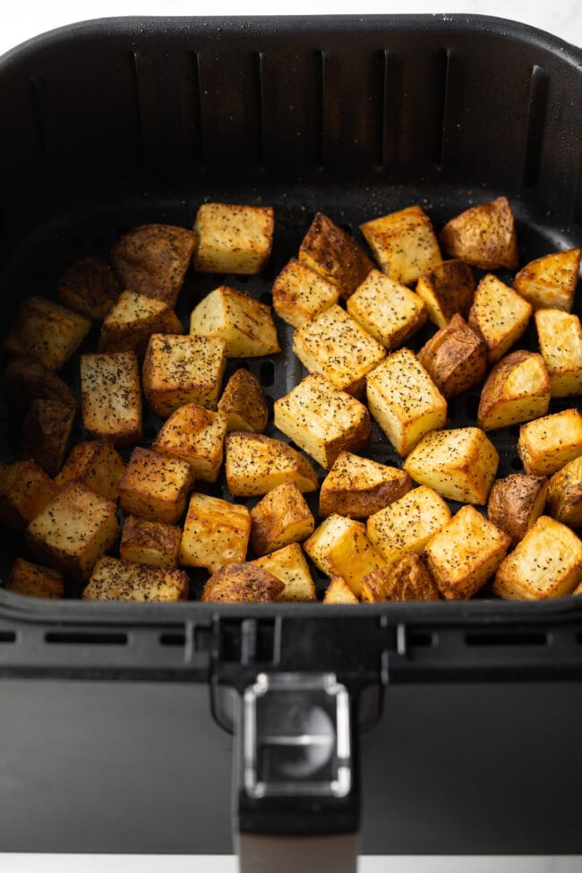 Results from the best air fried russet potatoes recipes: Cubes in the basket freshly air fried.