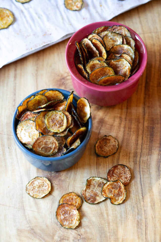 Chips made from zucchini served in small bowls. 