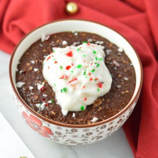 Peppermint Mocha Oatmeal makes for a warm and comforting breakfast recipe for the holidays. topped with yogurt and crushed candy canes.