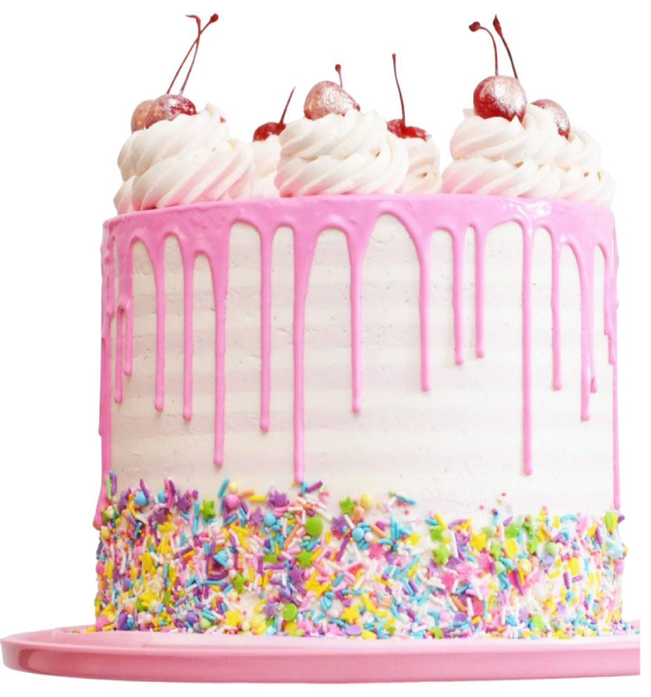 A white cake with pink icing drips, topped with whipped cream and cherries, and decorated with colorful sprinkles at the base on a pink platter—perfect for showcasing at any dessert franchise.