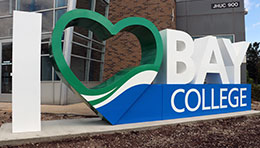 I Love Bay College sign outside the Joseph Heirman University Center