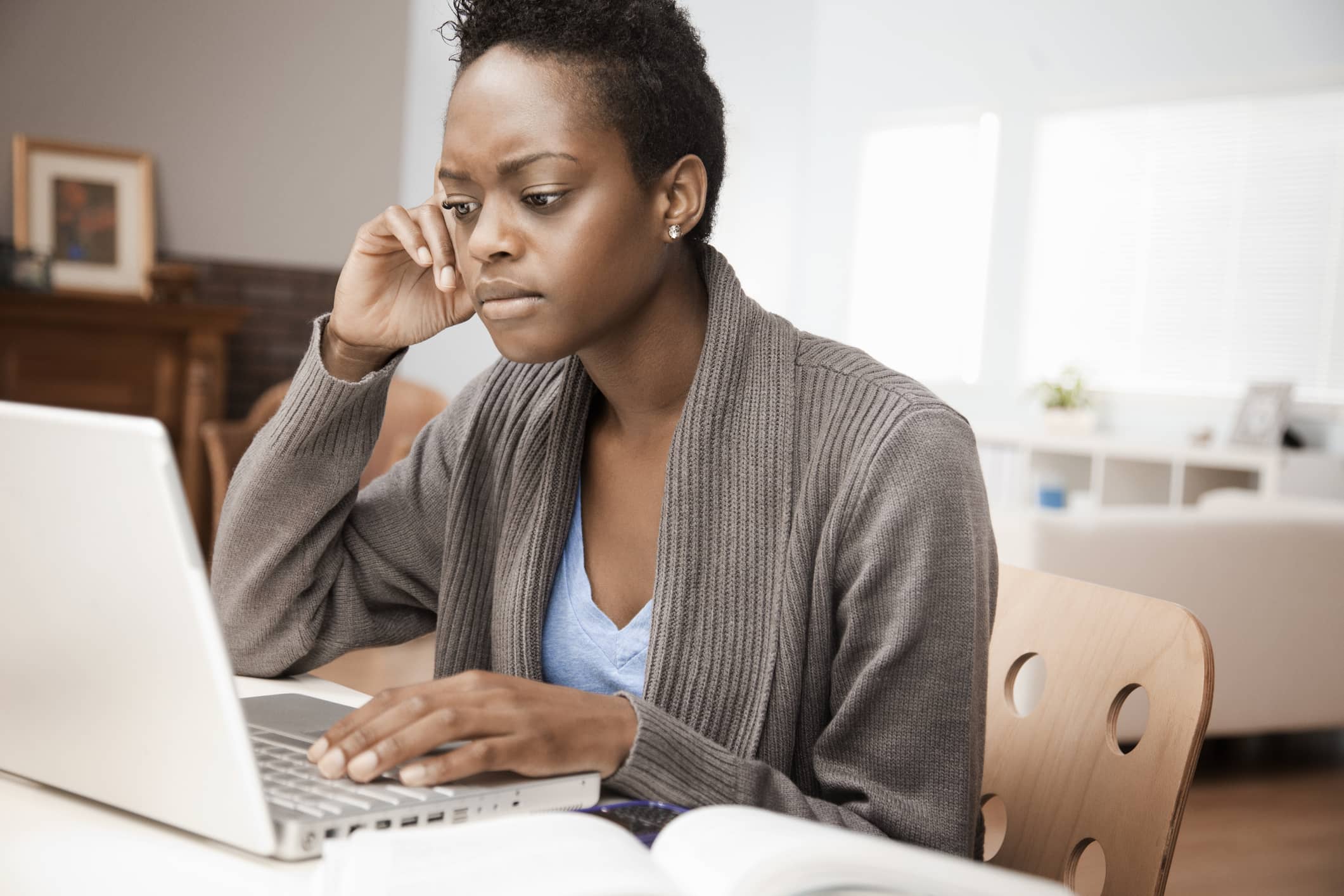 Woman-pensive-over-her-laptop-effects-of-peer-pressure