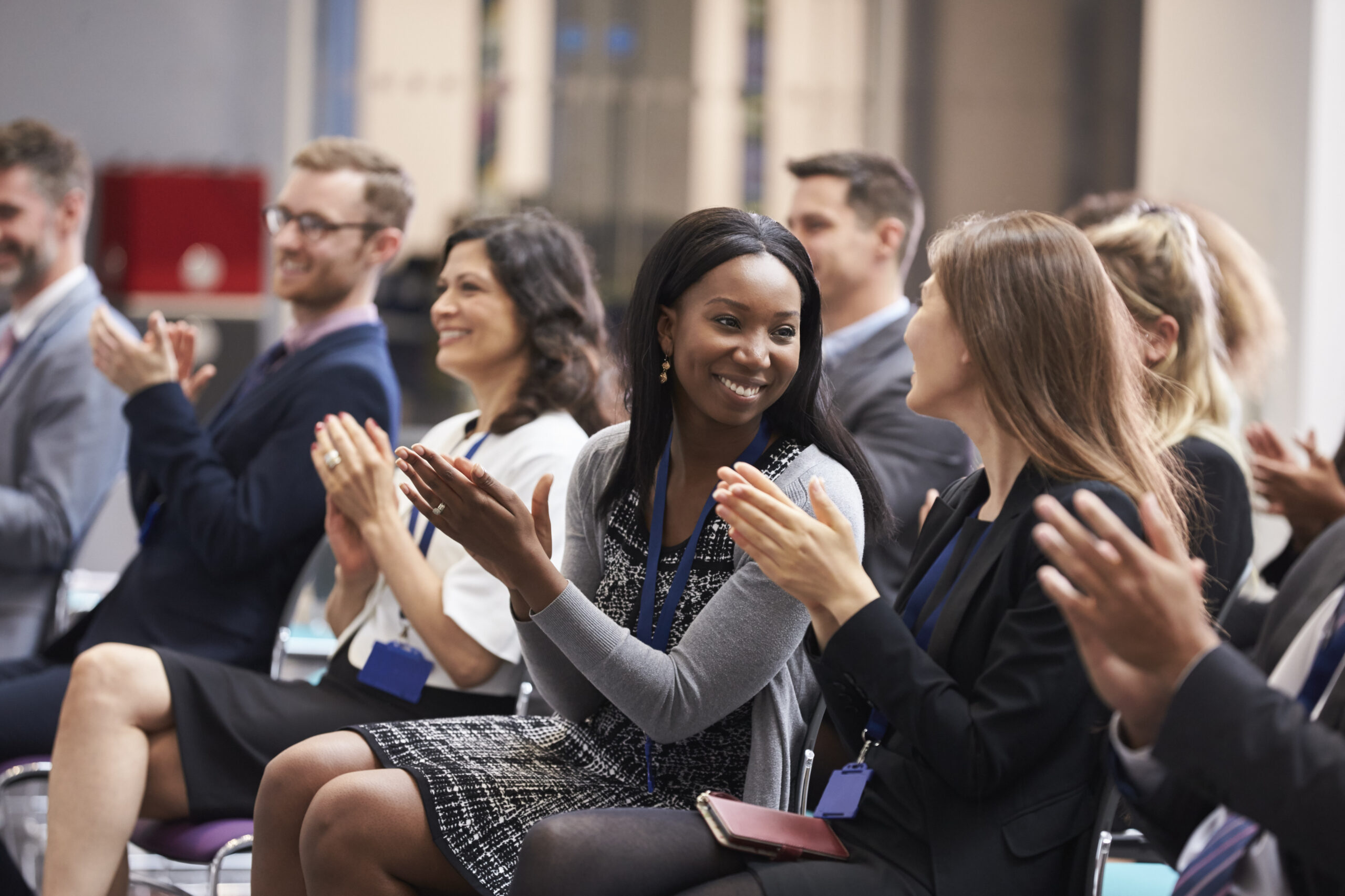 Conference attendees clapping