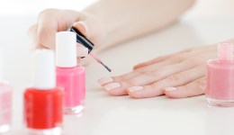 Woman painting nails, close-up