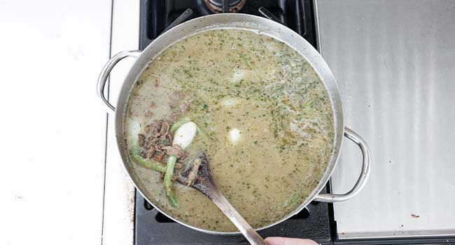 stock and onions in a pot