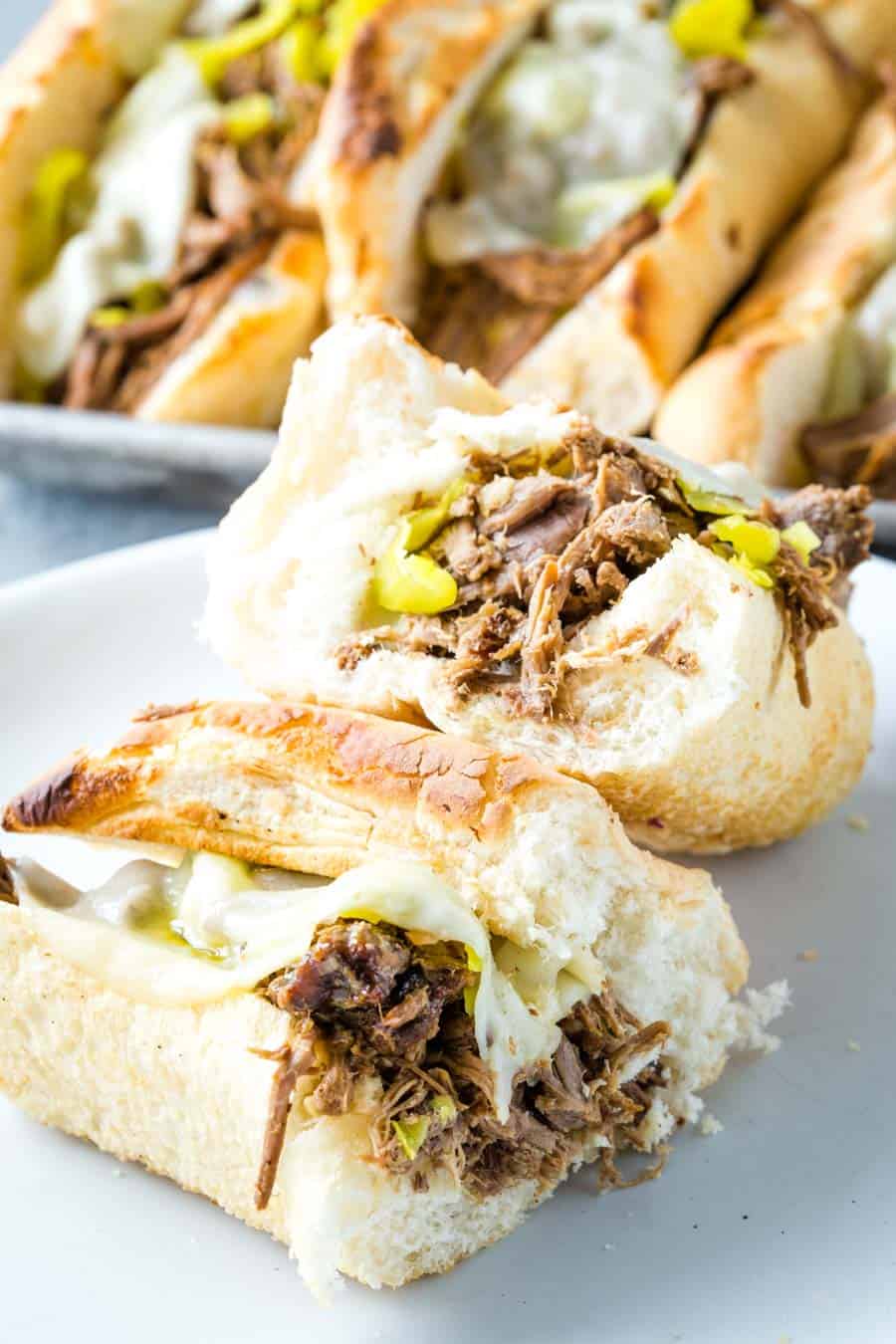 an Italian Beef Sandwich halves on a white plate