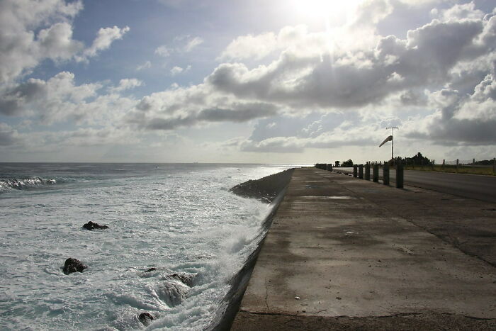 waves near the asphalted road