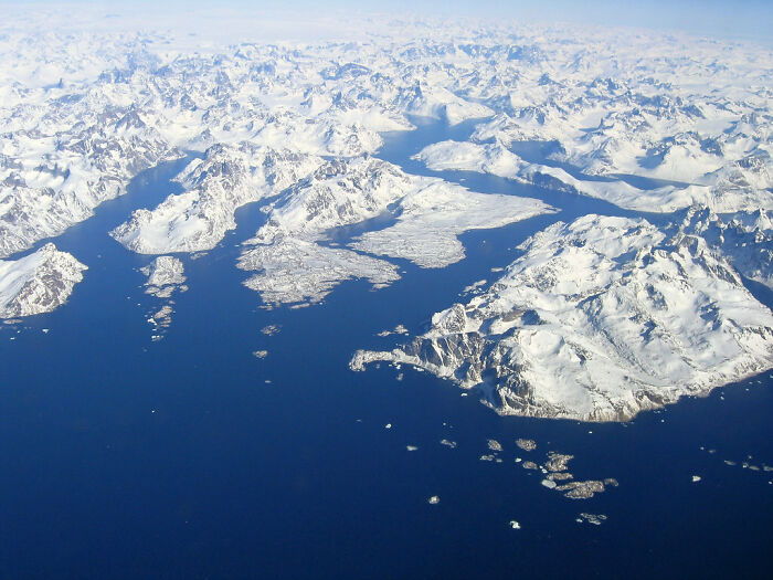 snowy hills and ocean from the height