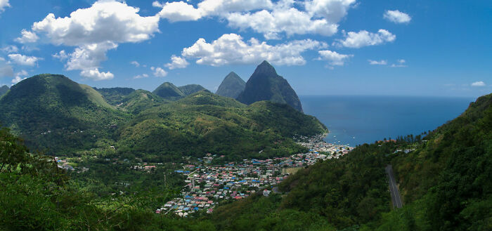 green hills around the buildings near the sea from the height