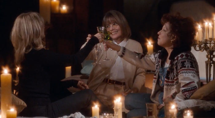 Three friends clinking glasses surrounded by candles, symbolizing iconic friendship duos.