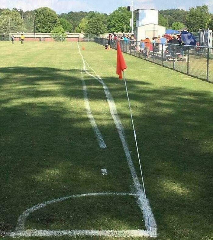 Soccer field with wonky boundary lines, illustrating lazy-infuriating-people's work.