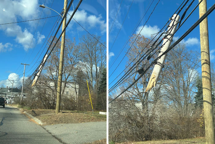 Leaning utility pole with damaged wires on a clear day, showcasing lazy-infuriating-people's neglect of maintenance.