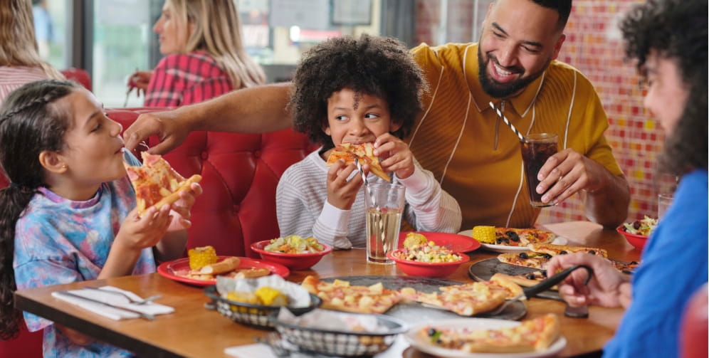 family enjoying a meal out