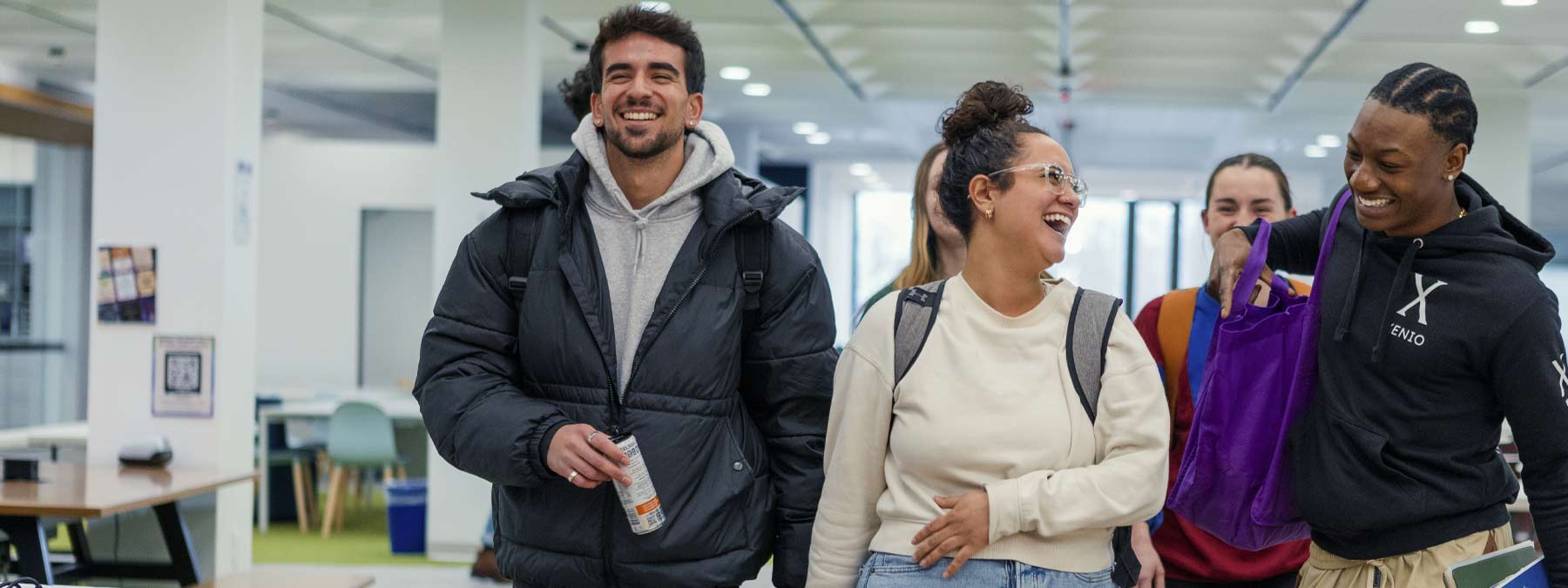 group of students laughing in the Heckman Center