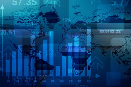 Financial charts laid over a world map