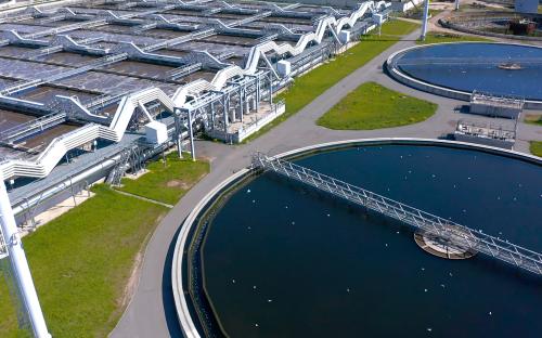 Aerial view of the wastewater treatment plant. Pumping station and drinking water supply. Industrial and urban water treatment for a big city. Round sedimentation tanks.