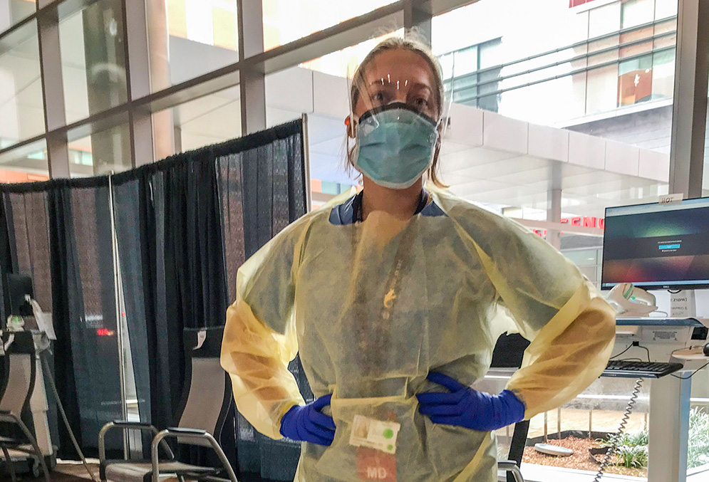 Boston Medical Center doctor Sarah Kimball poses for a photo wearing her PPE gear at the hospital