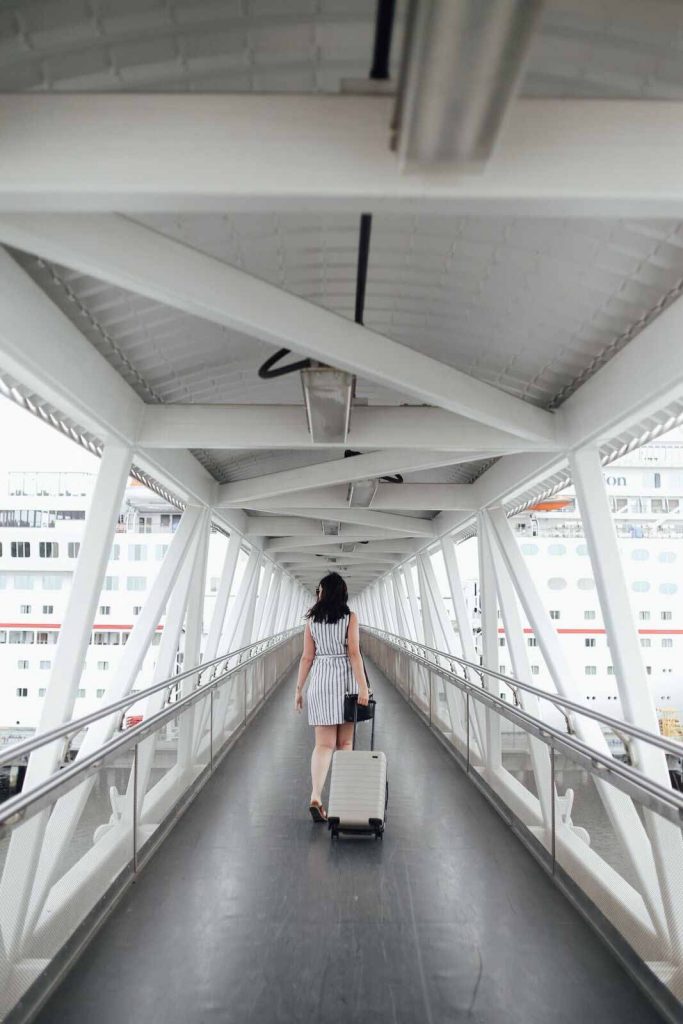 woman walking down cruise terminal